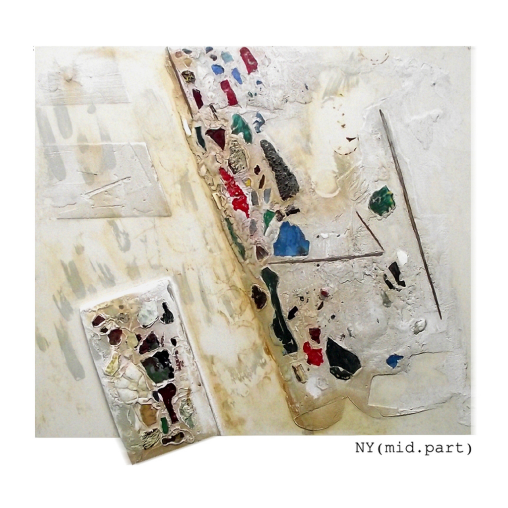 bits of a colorful paint and plaster fixed on white surface