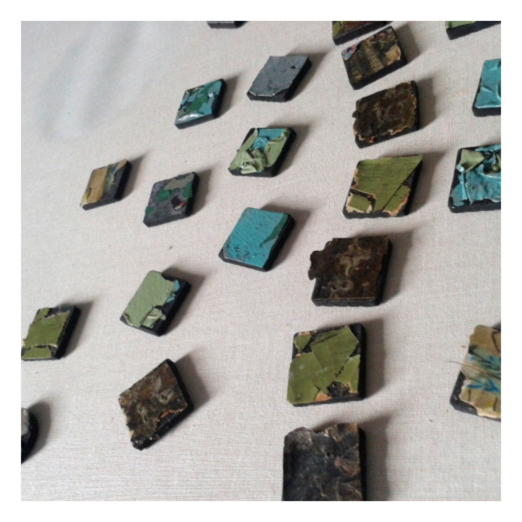 composition of small squares made of peeling paint and plaster